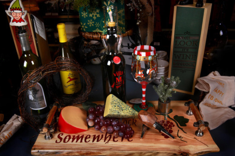 Holiday cheese board and wine bottles