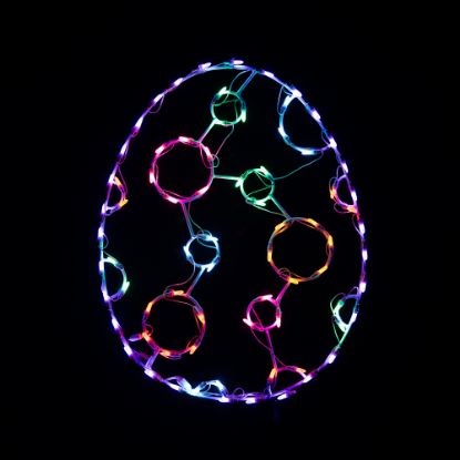lit multicolored Poka dot lighted egg on black background