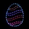 lit multicolored swirl lighted egg on black background