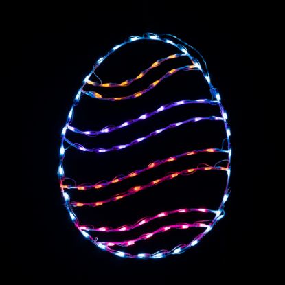 lit multicolored swirl lighted egg on black background