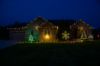 Front of home at night, lit by warm white lights including C9 bulb Glitzer product