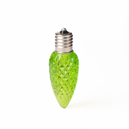 Single C9 bulb, lime, on white background