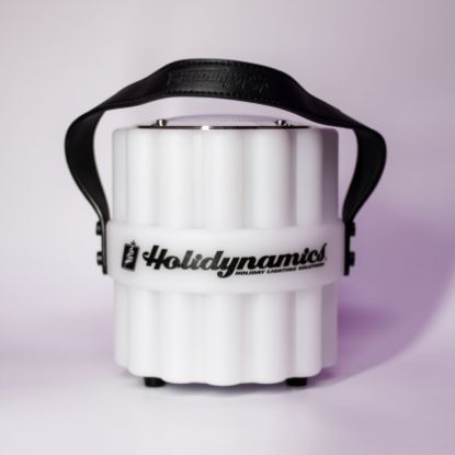 Plastic bluetooth speaker labeled with Holidynamics logo on the middle band displayed unlit and forward facing on white background