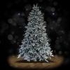 Full Noble 10 foot flocked Christmas tree, spotlit and lighted on black background with wooden floor.