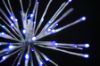 Extreme close-up of the Blue Spritzer displayed lit on a black background