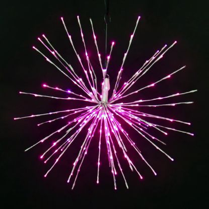 Pink Spritzer displayed lit on a black background