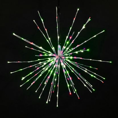 Christmas themed (pure white, green, and red) Spritzer displayed lit on a black background