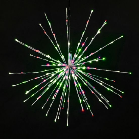 Christmas themed (pure white, green, and red) Spritzer displayed lit on a black background