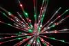 Extreme close-up of the Christmas themed (pure white, green, and red) Spritzer displayed lit on a black background