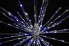 Extreme close-up of the pure white and blue Spritzer displayed lit on a black background