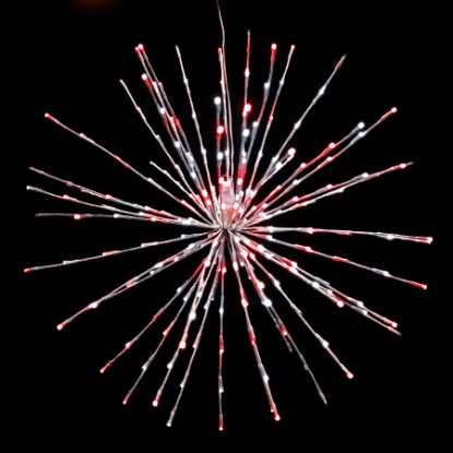 Pure white and red Spritzer displayed lit on a black background