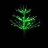 Paramount Spritzer yard stake decoration illuminated in green against a black background.