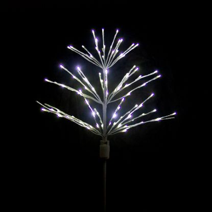 Paramount Spritzer yard stake decoration illuminated in pure white against a black background.