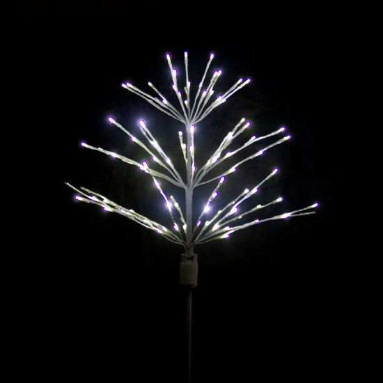 Paramount Spritzer yard stake decoration illuminated in pure white against a black background.