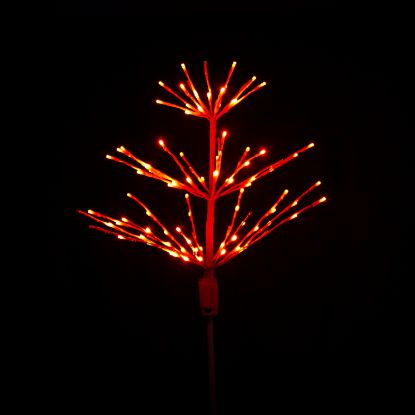 Paramount Spritzer yard stake decoration illuminated in blue against a black background.