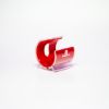 A small, plastic cellphone holder with a red interior and clear exterior, featuring the Holidynamics logo on the front. The holder is shaped like a curved “C” and sits on a white background.
