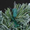Tree/Shrub Mini Light Clip displayed holding a light onto an artificial shrub