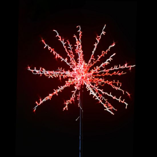 Oversized Spritzer lit red and displayed on black background