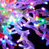Extreme close up of Oversized Spritzer lit multi-colored and displayed on black background