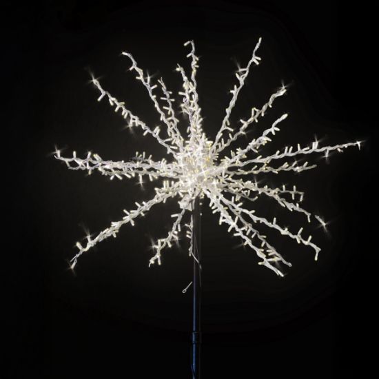 Classic white Spritzer displayed lit on a black background and mounted on a white pole